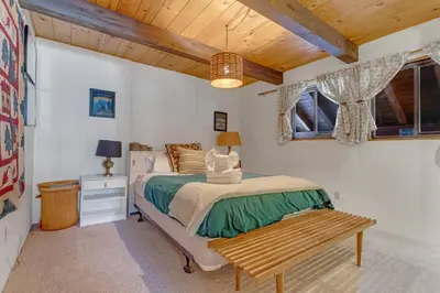a bedroom with a bed and a wooden ceiling at Popular A-frame Cabin With Deck & Views - Vh 216 in Bear Valley
