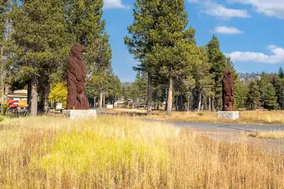 two statues of bears standing in a field at Year Round Condo- Sleeps 5! - Tamarack #17 in Bear Valley