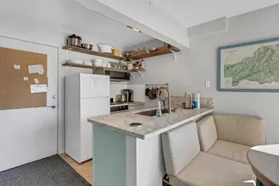a kitchen with a white refrigerator and a counter at Great Location Corner Condo - Tamarack #10 Pets Ok in Bear Valley