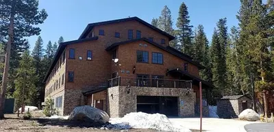 a large brick building with a balcony on the front at Modern Condo - Great Location! in Bear Valley