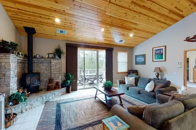 a living room with a couch and a fireplace at Murray Lake Retreat in Bass Lake