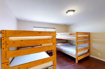 two bunk beds in a small room with at Calandri Lakeview House in Bass Lake