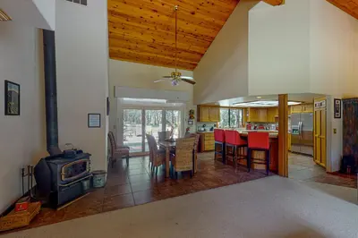 a kitchen and living room with a stove and a table at Yosemite Nutter Ranch in Mariposa