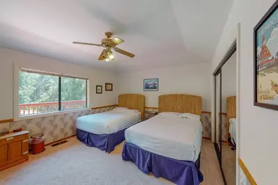 a bedroom with two beds and a ceiling fan at Yosemite Nutter Ranch in Mariposa