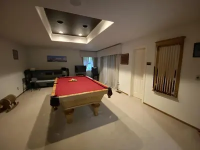a living room with a pool table in it at Yosemite Nutter Ranch in Mariposa
