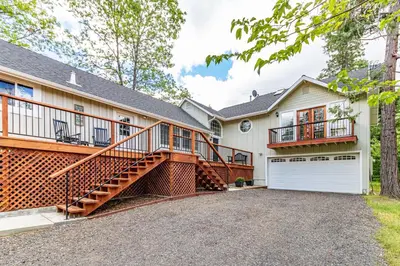 a house with a staircase and a garage at Brier Escape in Bass Lake