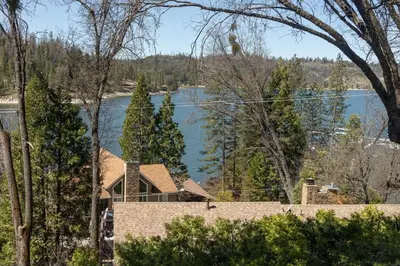 a house with a view of a lake at Harris Lakeview Cabin in Bass Lake