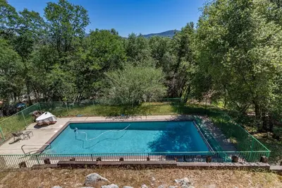 an overhead view of a swimming pool in a yard at Hodges Hill Yosemite House in Oakhurst