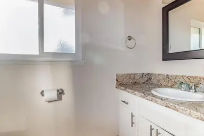 a bathroom with a sink and a mirror at Pine Ridge Peak in Oakhurst