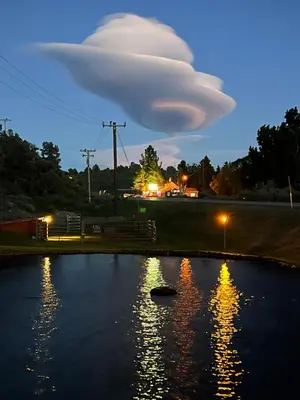 a cloud over a pond at night at Willow Springs Resort in Bridgeport