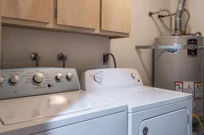 a white washer and dryer in a kitchen at Warm and cozy upgraded 2 bedrm 2 bath single level condo in Snowcreek complex phase IV 563 Sleeps 6 in Mammoth Lakes