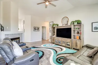 a living room with a couch and a tv at 8 Mi to Dtwn Reno Cozy Sparks Escape with Fireplace in Sparks