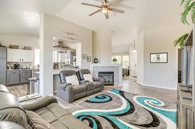 a living room with a couch and a fireplace at 8 Mi to Dtwn Reno Cozy Sparks Escape with Fireplace in Sparks