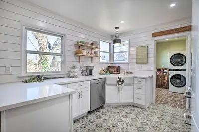 a white kitchen with a sink and a dishwasher at Vintage Bishop House in Downtown with Porch Swing! in Bishop