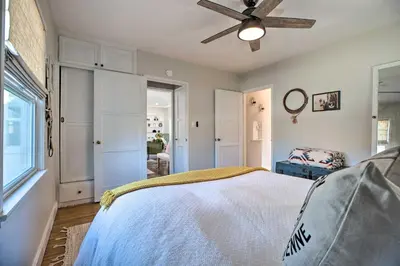 a bedroom with a bed and a ceiling fan at Vintage Bishop House in Downtown with Porch Swing! in Bishop