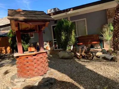 a brick fireplace in front of a house at Kernville - walk to River Kern & Downtown in Kernville