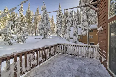 a balcony of a house with snow covered trees at Great for Groups Soda Springs Cabin with Deck! in Soda Springs