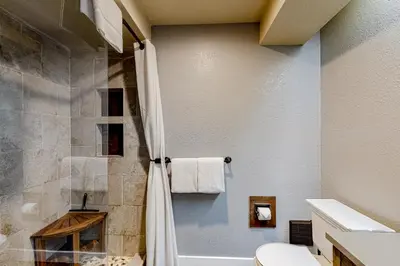 a bathroom with a shower and a toilet at Snowcreek 625 in Mammoth Lakes