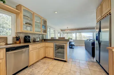 a kitchen with wooden cabinets and a refrigerator at Lake Lookout in Stateline