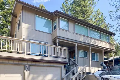a large house with a balcony and a garage at Lake Lookout in Stateline