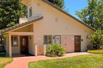 a small house with a driveway in front of it at Northshore Lakeview Getaway in Bass Lake