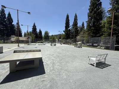 a park with a bench and a skate park at Willard Lake House in Bass Lake