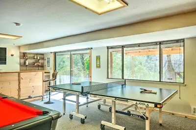 a ping pong room with a ping pong table at Groveland Cabin with Outdoor Perks and Game Room in Groveland