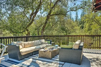 a patio with two couches and a coffee table at Groveland Cabin with Outdoor Perks and Game Room in Groveland