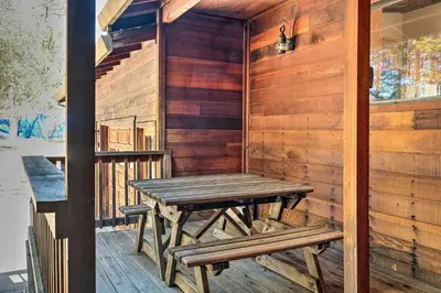 a wooden sauna with a wooden table and benches at Groveland Cabin with Outdoor Perks and Game Room in Groveland