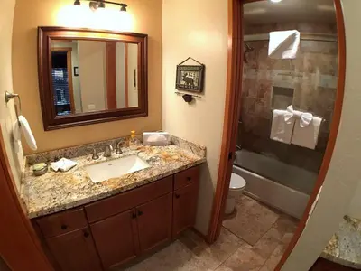 a bathroom with a sink and a toilet and a mirror at 2 Bedrooms Premium Condos in Mammoth Lakes