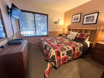 a bedroom with a bed with a quilt on it at 2 Bedrooms Standard Condos in Mammoth Lakes