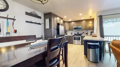 a kitchen with a table and a counter top at Mammoth Estates Condo - Free Parking & Pet Friendly in Mammoth Lakes