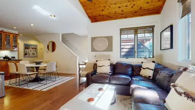 a living room with a couch and a table at Grayfox 2 Pet-Friendly, 5-Star with Private Hot Tub, 2 Car Garage and Prime Location condo in Mammoth Lakes