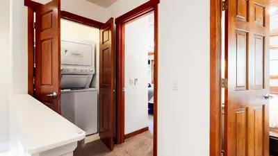 a bathroom with a toilet and a washer and dryer at Grayfox 2 Pet-Friendly, 5-Star with Private Hot Tub, 2 Car Garage and Prime Location condo in Mammoth Lakes