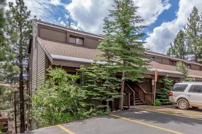 a car parked in front of a building at Val DIsere 32 Pet-Friendly, Walk To The Village, Private Washer Dryer, Spacious Floorplan condo in Mammoth Lakes