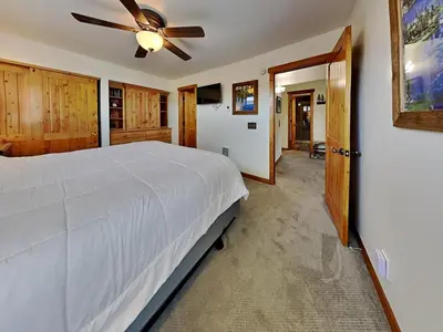 a bedroom with a white bed and a ceiling fan at Summer Fun - SLOPESIDE 4BR 3BA with 3 Spas, Pool and Sauna - Perfect for Family and Friend Getaways All Year Round 1849 Condos 693 condo in Mammoth Lakes