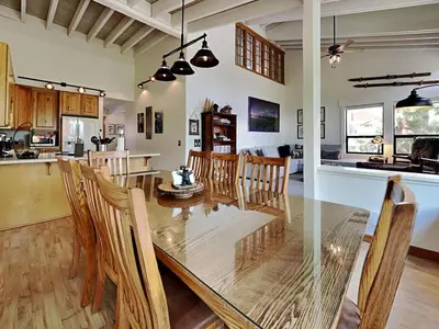 a dining room and kitchen with a table and chairs at Summer Fun - SLOPESIDE 4BR 3BA with 3 Spas, Pool and Sauna - Perfect for Family and Friend Getaways All Year Round 1849 Condos 693 condo in Mammoth Lakes