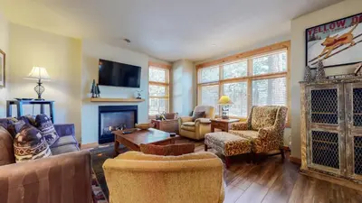 a living room filled with furniture and a fireplace at Solstice 11 Amazing Location on Golf Course, Heated Garage, Private Washer Dryer condo in Mammoth Lakes