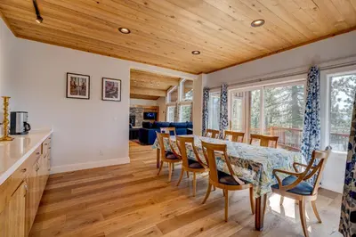 a kitchen and dining room with a table and chairs at Mountain & Lake-View Delight in Truckee