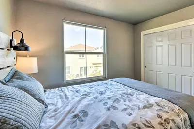 a bedroom with a bed and a window at Modern Sacramento House about 12 Mi to Downtown! in Sacramento
