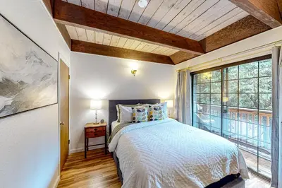 a bedroom with a bed and a large window at Hidden Haven in Arnold