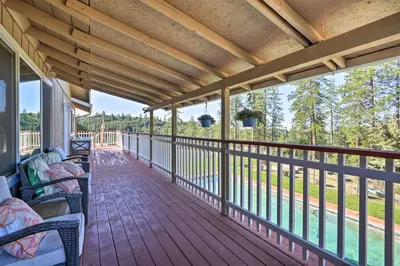 a porch with chairs and a view of the water at Jackson Escape with Hot Tub and Mtn Views! in Jackson