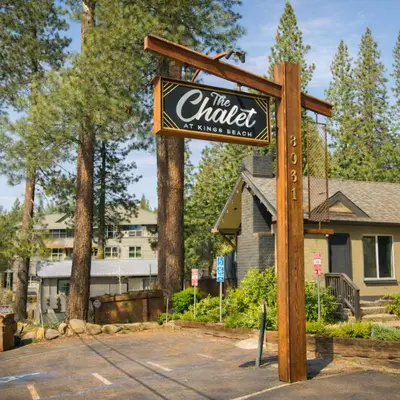 a sign for a hotel in front of a house at The Chalet at Kings Beach Unit 1 in Kings Beach