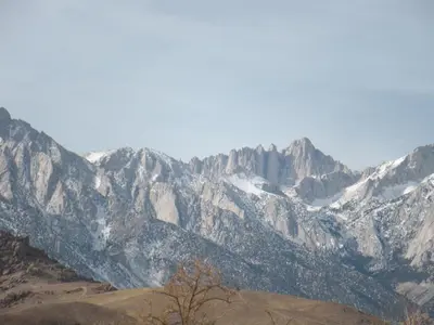 a view of a mountain range with snow covered mountains at Lone Pine Budget Inn in Lone Pine