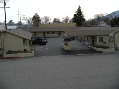 a parking lot in front of a building at Lone Pine Budget Inn in Lone Pine
