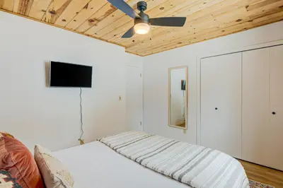 a bedroom with a bed and a ceiling fan at Bolzano's Getaway in Truckee