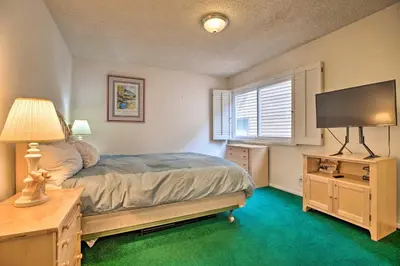 a bedroom with a bed and a flat screen tv at Mammoth Lakes Townhome Less Than 2 Mi to Ski Area! in Mammoth Lakes