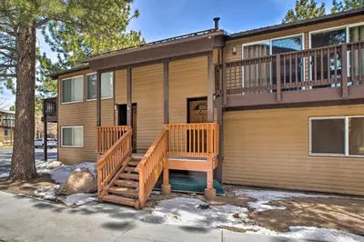 a house with a large deck on the front of it at Mammoth Lakes Townhome Less Than 2 Mi to Ski Area! in Mammoth Lakes