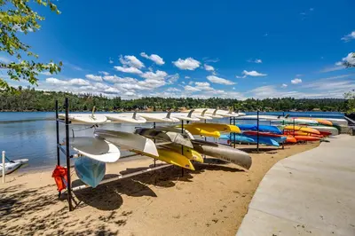 a bunch of boats are lined up on the beach at The 19th Hole in Groveland