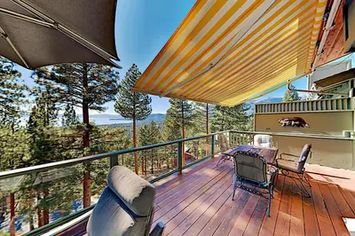 a balcony with a table and chairs on a deck at Bitterbrush 25 in Incline Village